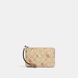 COACH CORNER ZIP WRISTLET IN SIGNATURE CANVAS WITH NOSTALGIC DITSY